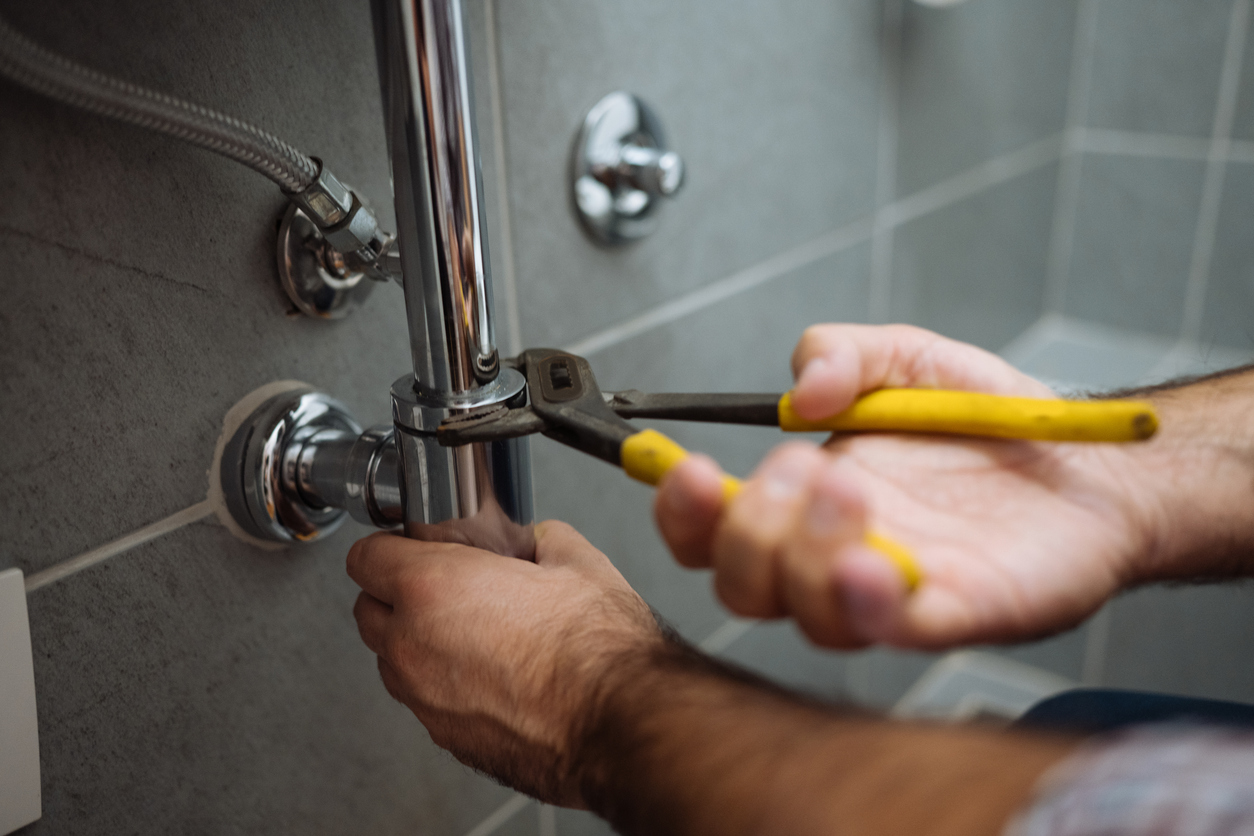 Plumber working on shower