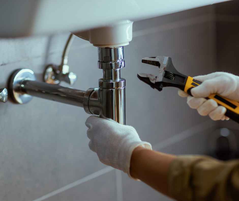 Plumber performing work